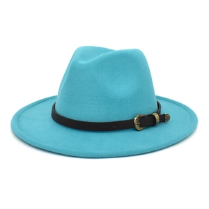 Detailed view of turquoise wool fedora hat with a black leather belt and vintage gold buckle