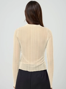 Detail of sheer beige long sleeve top featuring vertical ribbed texture and slim fit