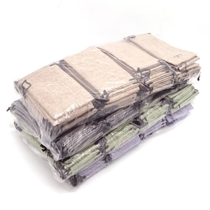 Linen drawstring sunglasses pouches in bulk stacked in transparent packaging bags