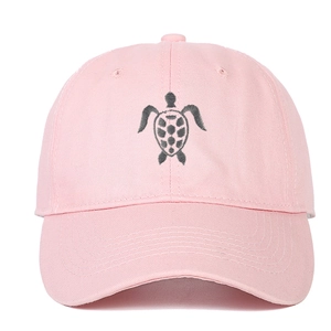 Pink cotton baseball cap with embroidered sea turtle on the front and curved brim