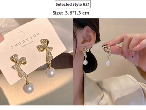 Macro view of crystal bow pearl drop earrings with 3.6x1.3cm size detail for women