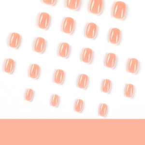 Glossy nude pink short press-on nail set with 24 pieces in various sizes on white background