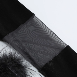 Detail of black velvet sleeve with transparent mesh and feather trim craftsmanship
