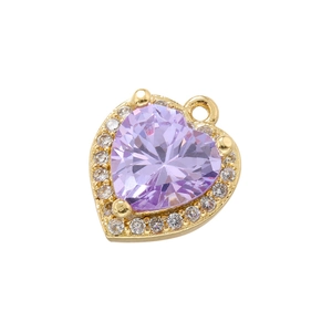 Macro shot of 18K gold plated heart pendant with purple zircon and tiny crystals
