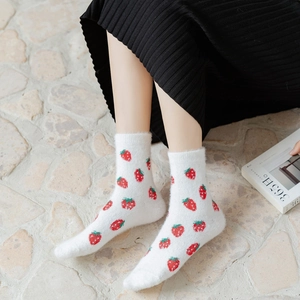 Women's white fuzzy mink velvet socks with red strawberry patterns for winter warmth