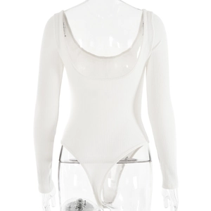 Macro shot of white ribbed knit bodysuit featuring a low back design and long sleeves
