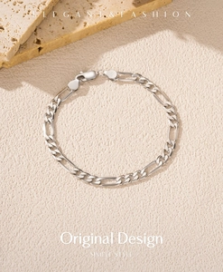 Macro shot of S925 sterling silver Figaro chain bracelet with authentic 925 hallmark