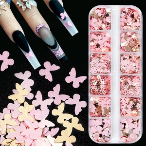 Pink and gold butterfly flower nail art sequins in a 12-slot storage box with manicured look