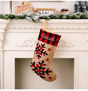 Customized burlap Christmas stocking with red plaid cuff and Sarah name embroidery