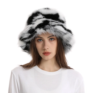 Stylish faux fur bucket hat featuring a trendy black and white spotted camouflage pattern