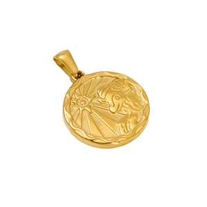 Macro detail of golden circular sun and moon face pendant in polished titanium steel