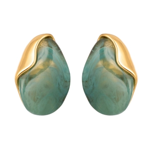 Detailed macro view of irregular turquoise resin marble earrings with gold metal top