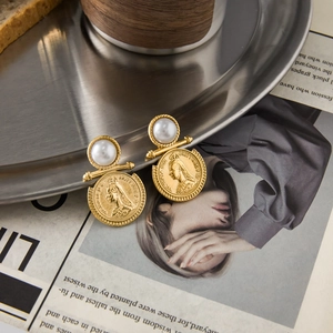 Vintage gold coin earrings with pearls featuring Queen Victoria portrait on metal tray