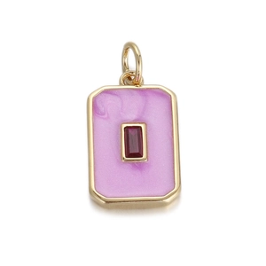 Detailed view of rectangular sunburst pendant with red stone and purple enamel inlay