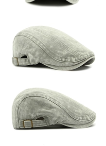 Detail of vintage washed grey beret with side metal adjustment buckle and twill texture