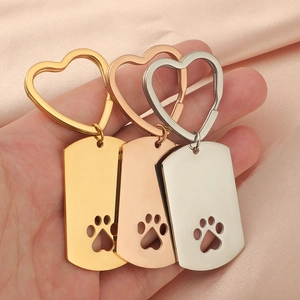Polished stainless steel heart keychain tags with hollow paw print in gold, rose gold, silver