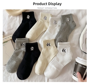 Close-up of cute panda embroidery on multi-color cotton ankle socks for women