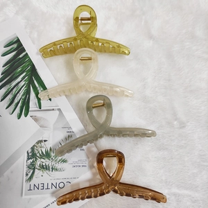 Set of four large jelly-colored hair claws in olive green, cream, grey and amber brown