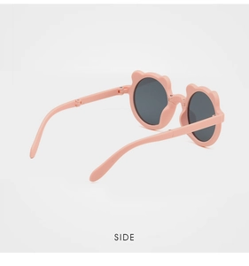 Detail view of foldable pink bear ear sunglasses for kids showing compact side structure