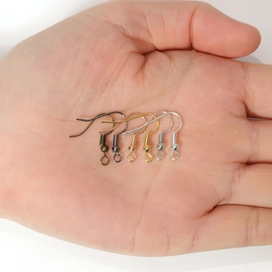 DIY jewelry earring hooks set in six metallic colors displayed on a hand palm