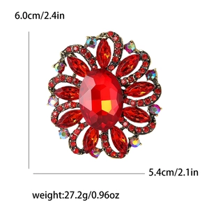 Red flower brooch with gold base, colorful rhinestones and size details in English