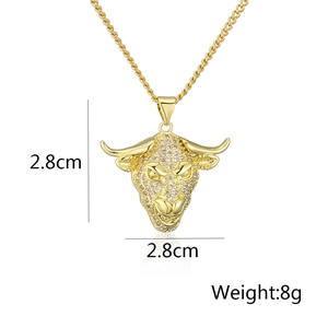 Macro detail of gold bull head pendant showing 2.8cm size dimensions and 8g weight