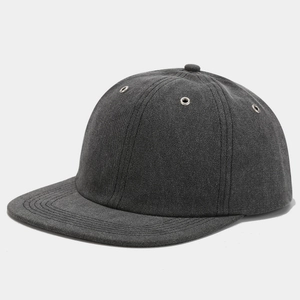 Detail view of washed dark grey baseball cap showing metal eyelets and reinforced stitching