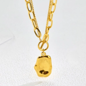 Chunky gold double-layer chain necklace with an irregular lava-style pendant for women