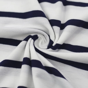 Detailed macro view of soft blue and white striped knit fabric texture and fine stitching