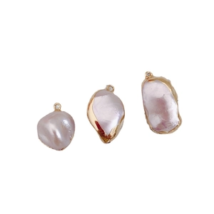 Three irregular baroque pearls with gold plating edges and rings for DIY jewelry