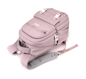 Detail view of pink travel backpack with white buckles and breathable mesh straps