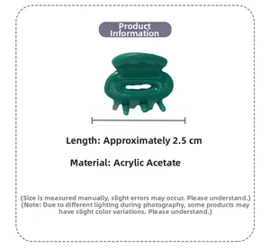 Detail view of 2.5cm green acetate mini hair claw clip with a glossy translucent finish
