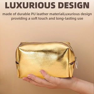 Luxurious golden PU leather cosmetic bag with soft touch and metallic texture held by hand