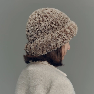 Chic gradient faux fur bucket hat for winter featuring thick plush texture in brown and beige