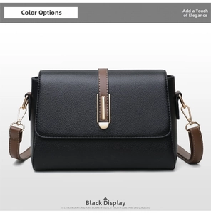 Detailed macro view of black pebble-grain leather bag with golden hardware buckle