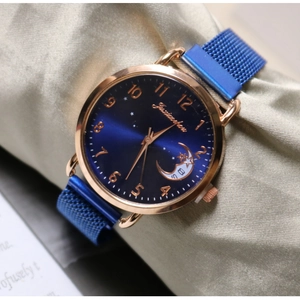 Elegant ladies quartz watch with blue sunray dial and moon phase on silk background