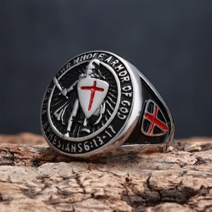 Macro shot of stainless steel shield ring showing relief details and bible engraving