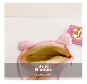 Detail of pink plush crossbody bag showing inner yellow lining and metal zipper closure