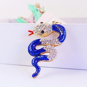 Cute golden alloy snake keychain with blue enamel and sparkling white rhinestones
