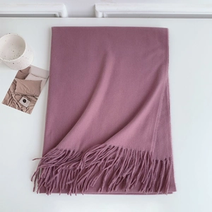 Close-up of rose pink imitation cashmere scarf featuring elegant fringe and soft texture