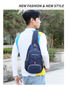 Detailed back view of man wearing dark blue nylon multi-pocket outdoor crossbody chest bag