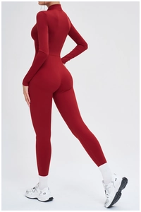 Detail of red long-sleeved thermal bodysuit showing slim fit and back seam design