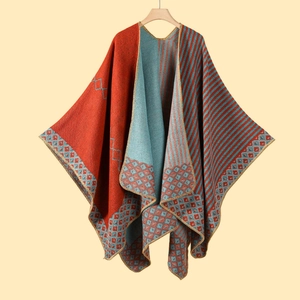 Detail of double-sided knit shawl with red blue stripes and geometric diamond pattern