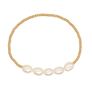 Elegant gold TOHO bead bracelet featuring five natural baroque pearls on a white background