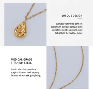 Macro detail of teardrop pendant in 18K gold plated surgical titanium steel finish