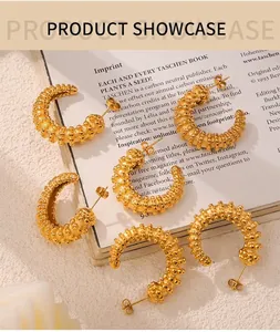 Detailed view of C-shaped gold-plated earrings with unique 3D grain texture and metallic finish