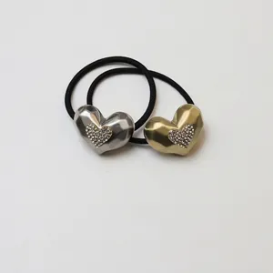 Glittering heart-shaped bear hair ties with metal texture and elastic bands in gold and silver