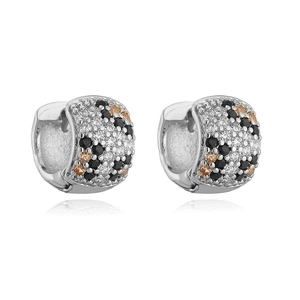 Close-up of silver-tone hoop earrings with leopard print micro-pave crystal inlay