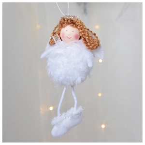 Detail of a plush angel Christmas ornament with white wings and brown hair hanging on warm lights
