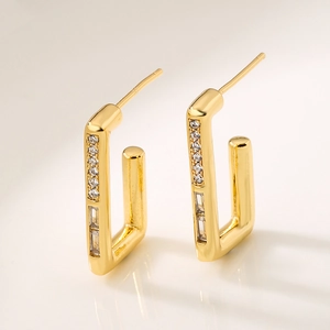 Luxurious 18K gold plated hoop earrings with rows of clear round and baguette cubic zirconia